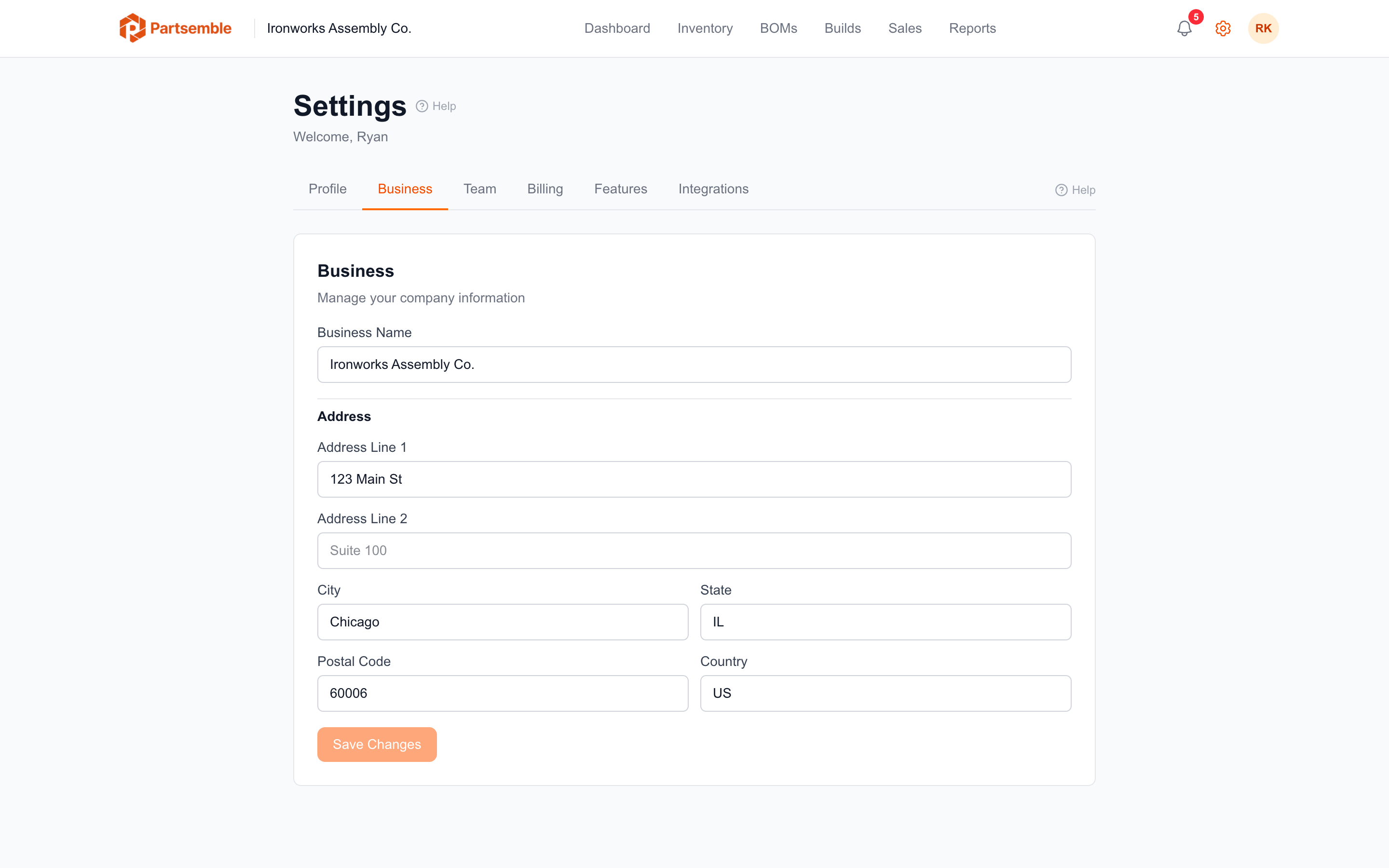Settings Business tab with company name, contact, and regional fields